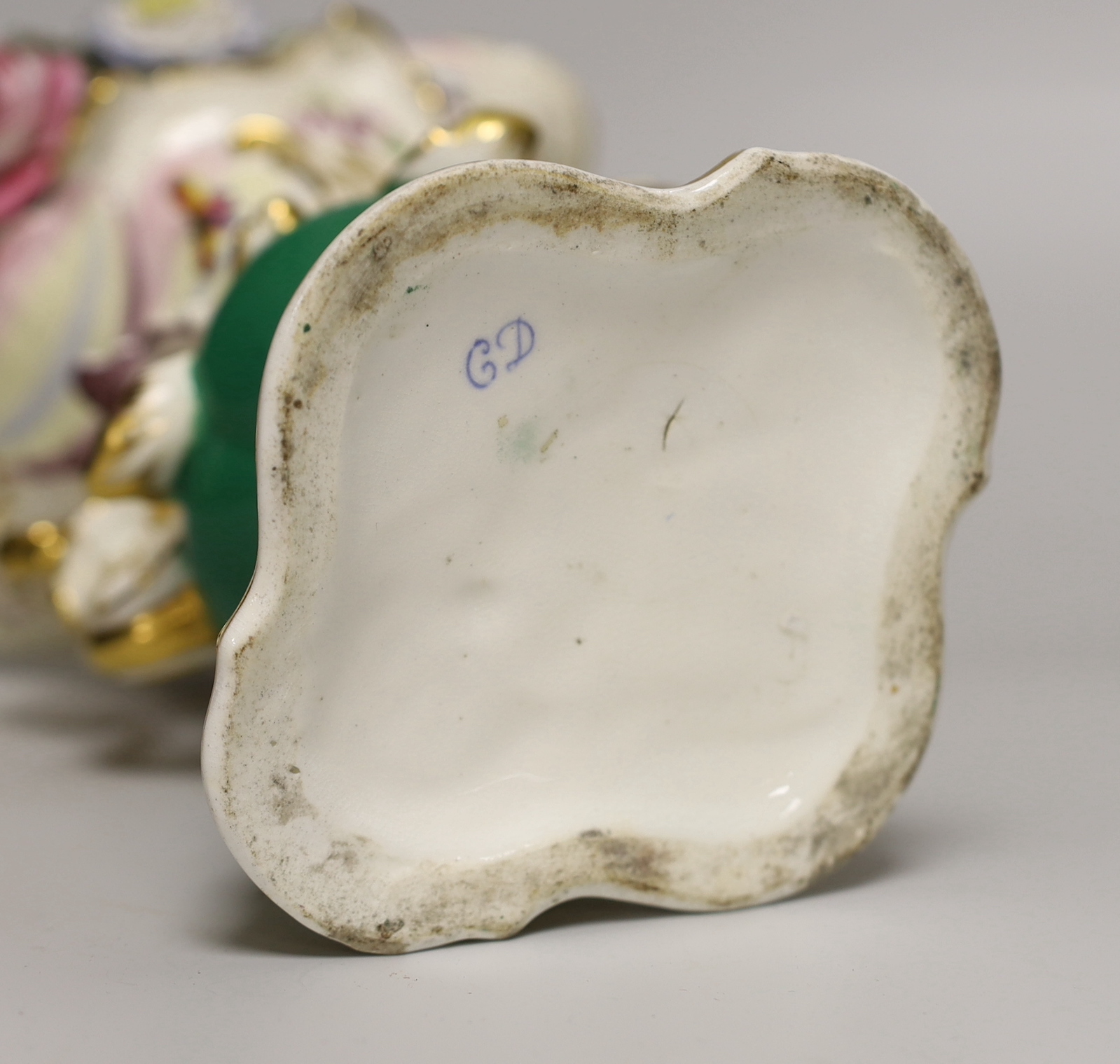 A 19th century Coalport two handled floral encrusted vase painted with flowers and a green ground, CD mark for Coalbrookdale, 21cm high